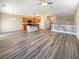 Open living room with hardwood floors and kitchen island at 9801 Fast Elk St, Las Vegas, NV 89143