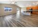 Open concept living room and kitchen with hardwood floors at 9801 Fast Elk St, Las Vegas, NV 89143