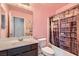 Bathroom with a vanity and a bathtub with a curtain that looks like a bookshelf at 10997 Sardinia Sands Dr, Las Vegas, NV 89141