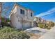 Charming two-story home featuring a two-car garage and a well-manicured, landscaped front yard at 10997 Sardinia Sands Dr, Las Vegas, NV 89141