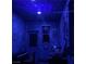Unique room with dark blue walls, celestial ceiling, and colorful decor at 10997 Sardinia Sands Dr, Las Vegas, NV 89141
