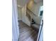 Bright entryway featuring wood-look floors and stairs leading to the upper level at 1433 Nocturnal Flight St, Las Vegas, NV 89138