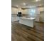 Spacious kitchen boasts an island, stainless steel appliances, and ample white cabinetry at 1433 Nocturnal Flight St, Las Vegas, NV 89138