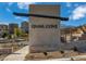 Entrance sign for Quail Cove neighborhood, featuring modern design and community charm at 1433 Nocturnal Flight St, Las Vegas, NV 89138