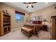 Cozy bedroom with southwestern decor, wood furniture, and ceiling fan at 1461 Sunshine Ct, Mesquite, NV 89034