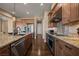 Modern kitchen with granite countertops and stainless steel appliances at 1461 Sunshine Ct, Mesquite, NV 89034