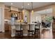 Eat-in kitchen with island seating and view to dining room at 1461 Sunshine Ct, Mesquite, NV 89034