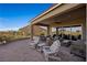 Covered patio with comfortable seating and views of the surrounding area at 1461 Sunshine Ct, Mesquite, NV 89034