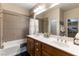 Elegant bathroom with double sinks, a soaking tub, and updated fixtures at 1511 Plaza Centre Dr # 105, Las Vegas, NV 89135