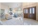 Bright and airy living room with a fireplace and tiled floors at 1540 Castle Crest Dr, Las Vegas, NV 89117