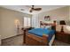 Bright bedroom with a wooden bed frame and neutral colored walls at 178 Uccello Dr, Las Vegas, NV 89138