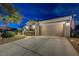 Well-maintained house exterior with spacious garage, American flag, and landscaped front yard at 2009 Fern Hill Ct, Henderson, NV 89052