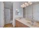 Elegant bathroom with double sinks, large mirror, and upgraded light fixtures at 2428 Granada Bluff Ct, Las Vegas, NV 89135