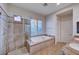 Spa-like bathroom featuring a walk-in shower and a large soaking tub at 2428 Granada Bluff Ct, Las Vegas, NV 89135