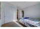 Bright bedroom with a double bed, closet, and access to a bathroom at 2428 Granada Bluff Ct, Las Vegas, NV 89135