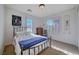 Charming bedroom with a double bed and plenty of natural light at 2428 Granada Bluff Ct, Las Vegas, NV 89135