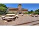 Outdoor fireplace and seating area in community at 2428 Granada Bluff Ct, Las Vegas, NV 89135