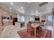 Open concept dining area with views into kitchen and living room at 2428 Granada Bluff Ct, Las Vegas, NV 89135
