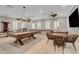 Game room features pool table, shuffleboard, ping pong, and seating at 2428 Granada Bluff Ct, Las Vegas, NV 89135