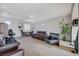 Spacious Gathering room featuring leather furniture and a home office area at 2428 Granada Bluff Ct, Las Vegas, NV 89135