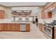 Open concept kitchen with island and stainless steel appliances at 2428 Granada Bluff Ct, Las Vegas, NV 89135