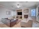 Comfortable living room with fireplace and ample natural light at 2428 Granada Bluff Ct, Las Vegas, NV 89135