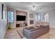 Spacious living room featuring a fireplace and built-in entertainment center at 2428 Granada Bluff Ct, Las Vegas, NV 89135