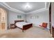 Relaxing main bedroom with plush carpet and an ensuite bathroom at 2428 Granada Bluff Ct, Las Vegas, NV 89135