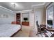 Main bedroom with built-in workspace and large window at 2428 Granada Bluff Ct, Las Vegas, NV 89135