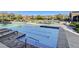 Community pool with lounge chairs and surrounding homes at 2428 Granada Bluff Ct, Las Vegas, NV 89135