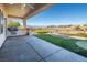 Covered patio with built-in grill and putting green, overlooking scenic views at 2446 Hardin Ridge Dr, Henderson, NV 89052