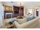 Comfortable living room with built-in shelving and fireplace at 2446 Hardin Ridge Dr, Henderson, NV 89052