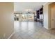 View of a spacious living room with tile floors and built-in shelving at 2446 Hardin Ridge Dr, Henderson, NV 89052