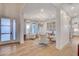 Open living room with hardwood floors and a view into the kitchen at 358 E Torino Ave, Las Vegas, NV 89123