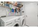 Laundry room with washer, dryer, and storage shelves at 3867 Desert Marina Dr # 248, Laughlin, NV 89029