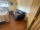 Bedroom with black couch and wood flooring at 4111 Sanderling Cir # 354, Las Vegas, NV 89103