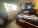 Cozy bedroom with a double bed and large window at 4111 Sanderling Cir # 354, Las Vegas, NV 89103