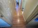 Light-toned laminate flooring hallway with doors to rooms at 4111 Sanderling Cir # 354, Las Vegas, NV 89103