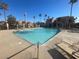 Community pool with lounge chairs for sunbathing at 4111 Sanderling Cir # 354, Las Vegas, NV 89103