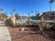 Community pool with surrounding landscaping and patio furniture at 4111 Sanderling Cir # 354, Las Vegas, NV 89103