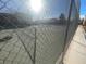 Community tennis court with chain-link fence at 4111 Sanderling Cir # 354, Las Vegas, NV 89103