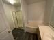 Bathroom featuring a vanity, soaking tub and glass door shower at 4316 W Lake Mead Blvd # 102, Las Vegas, NV 89108