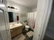 Clean bathroom with shower/tub combo, vanity, and wood-look flooring at 4316 W Lake Mead Blvd # 102, Las Vegas, NV 89108