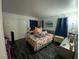 Bright bedroom with double doors, desk, and large bed at 4316 W Lake Mead Blvd # 102, Las Vegas, NV 89108