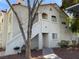 Apartment exterior featuring a sidewalk, outdoor grill, staircase, and covered parking at 4316 W Lake Mead Blvd # 102, Las Vegas, NV 89108