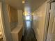 Hallway with built in cabinets and view of a bright room with windows at 4316 W Lake Mead Blvd # 102, Las Vegas, NV 89108