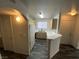 Galley kitchen with ample counter space, white appliances, and modern light fixtures at 4316 W Lake Mead Blvd # 102, Las Vegas, NV 89108