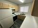 Well-lit kitchen featuring essential appliances, white countertops and wood cabinets at 4316 W Lake Mead Blvd # 102, Las Vegas, NV 89108
