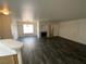 View of an open living space with a fireplace, hardwood floors, and light neutral walls at 4316 W Lake Mead Blvd # 102, Las Vegas, NV 89108