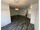 Open-concept living room featuring hardwood floors and modern lighting fixtures at 4316 W Lake Mead Blvd # 102, Las Vegas, NV 89108